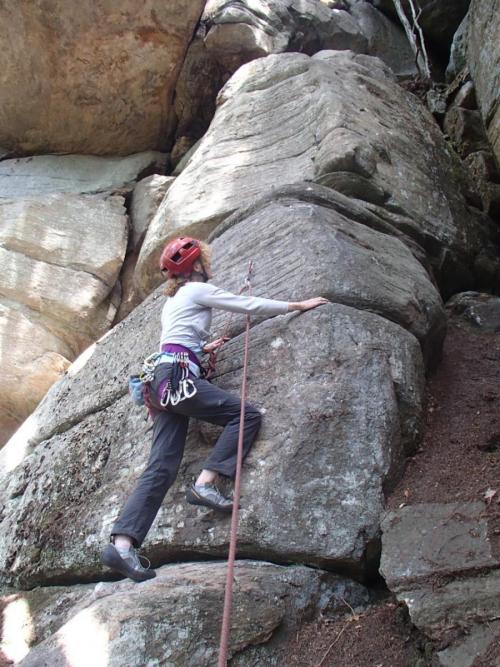 A picture of a climber planning to ascend